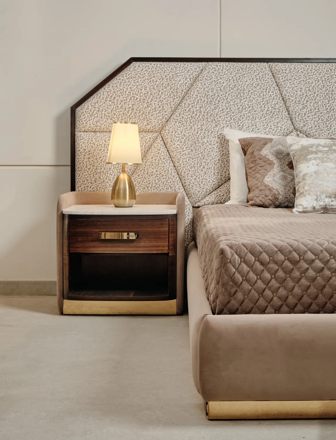 Bedroom detail with nightstand and warm lamp