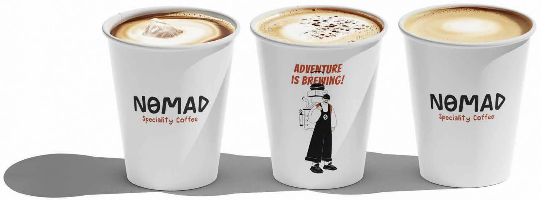 Nomad takeaway cups with the orange accent branding