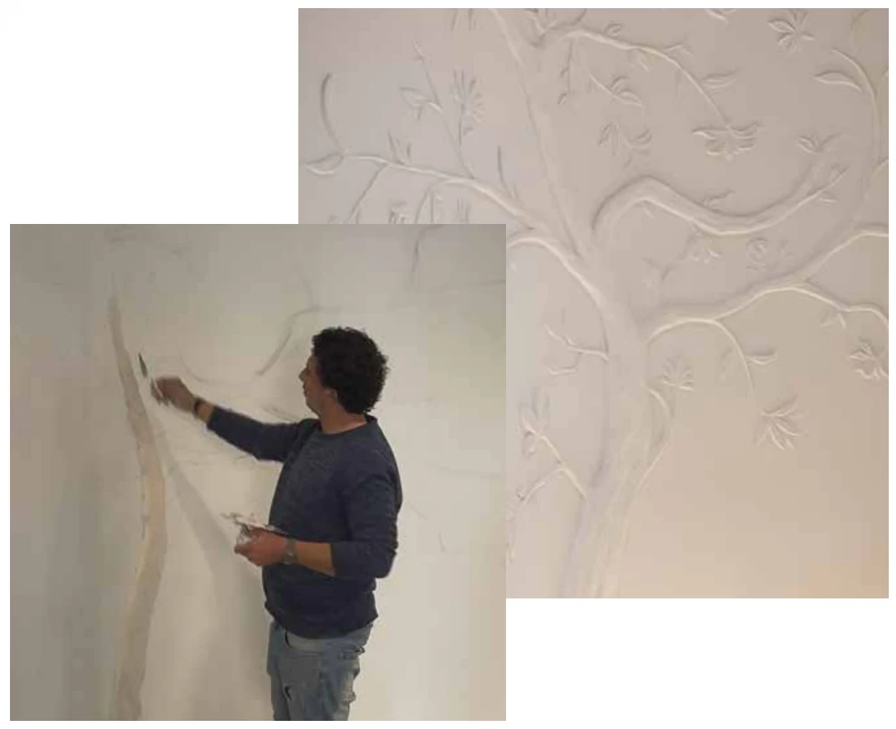 Craftsman carving the floral relief on the store wall