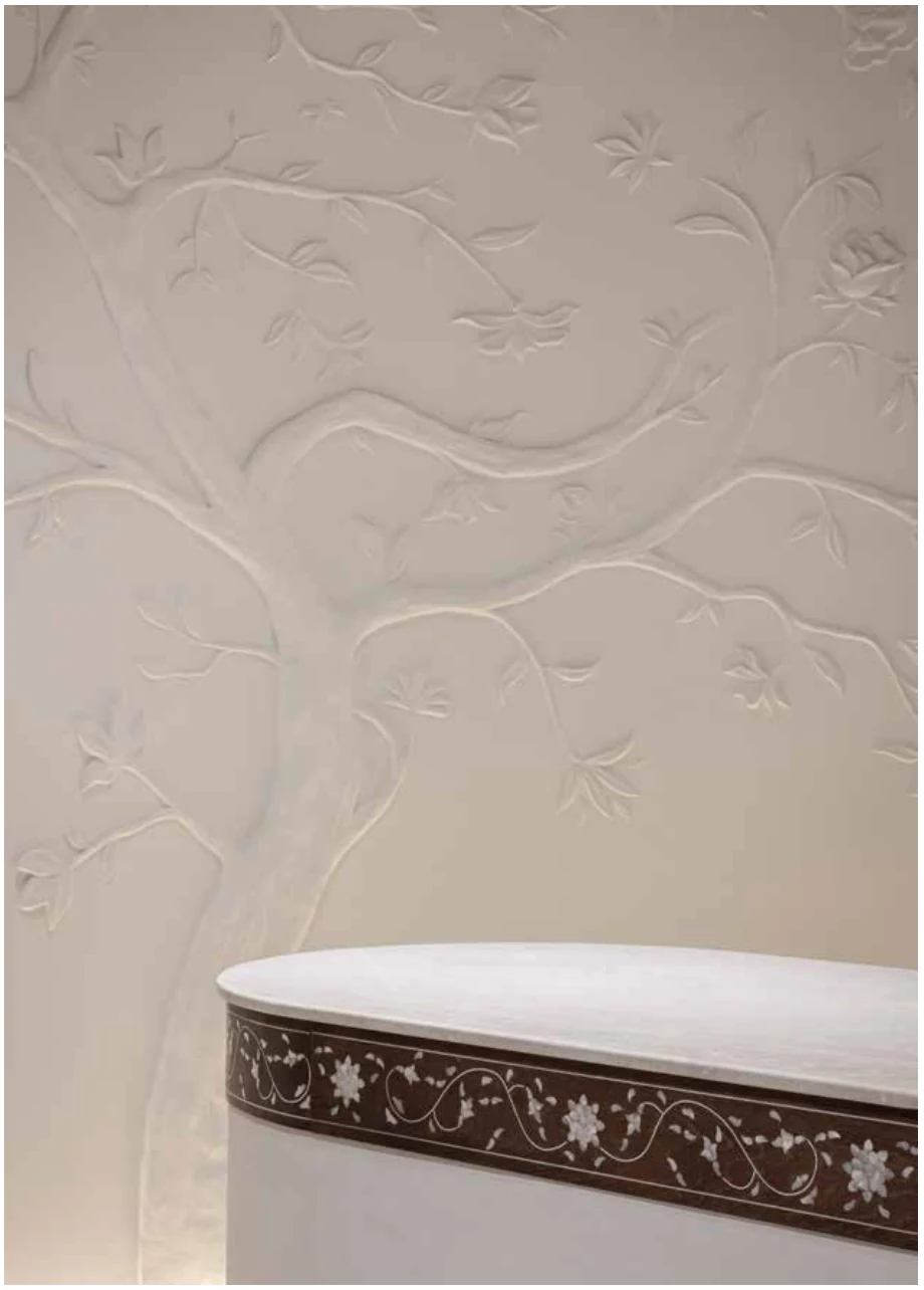Floral relief detail beside the counter