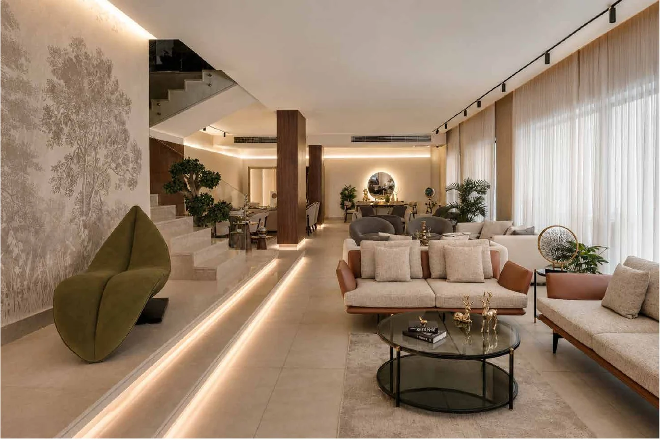 Showroom seating vignette with layered lighting and soft textures