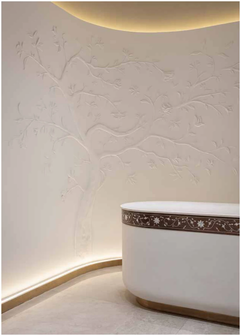 Curved counter under warm cove lighting