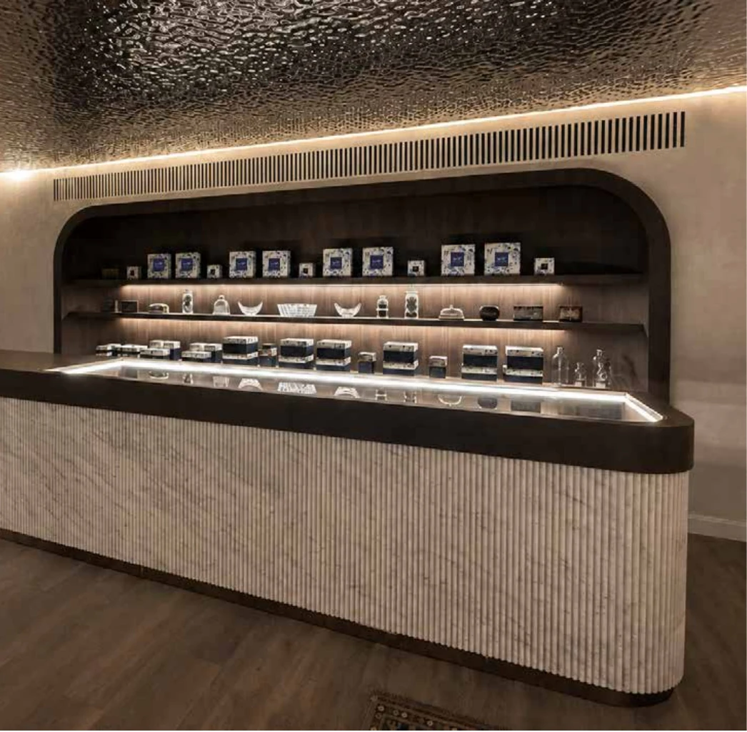 Long pastry counter with warm cove lighting