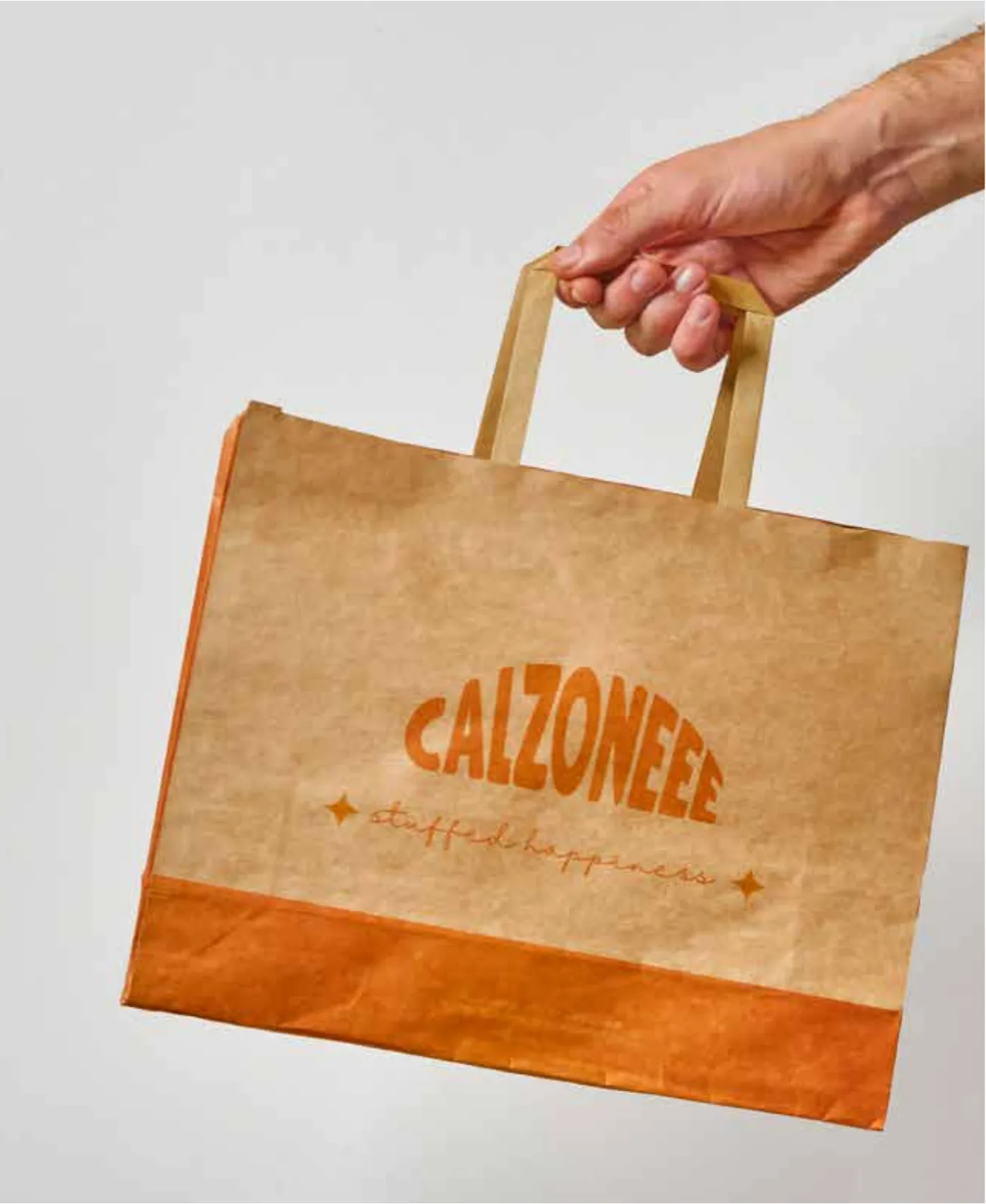 Kraft takeaway bag with the Calzoneee wordmark