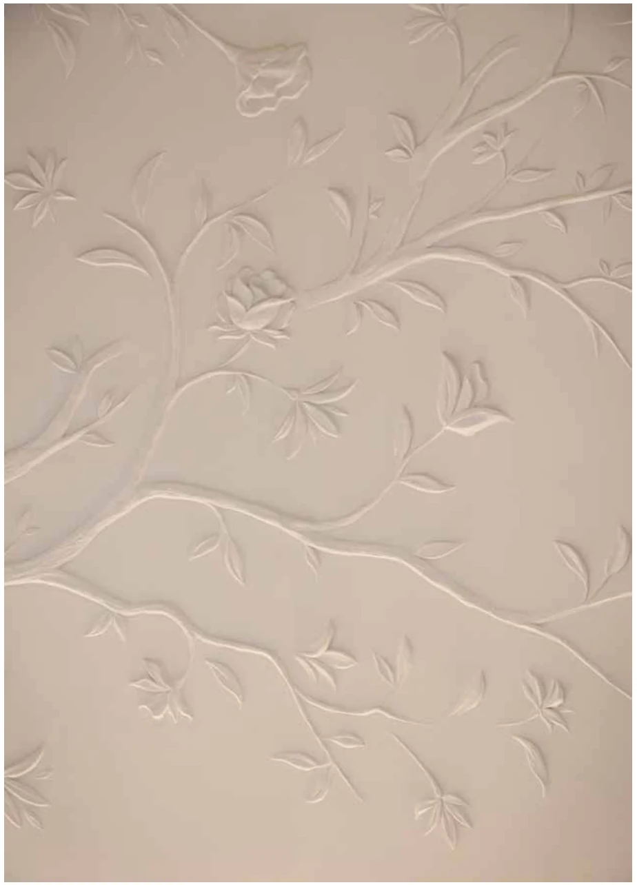 Close-up of the carved botanical wall relief