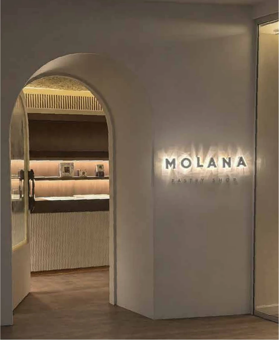 Arched entrance with backlit Molana lettering