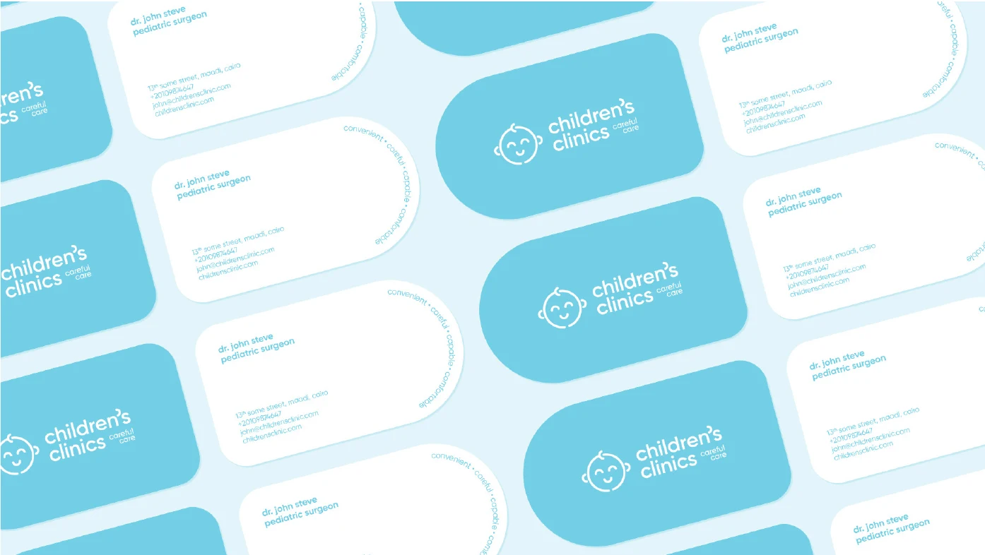 Business cards in blue and white with the clinic wordmark